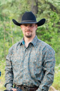 Frankie Anderson wearing a cowboy hat outdoors